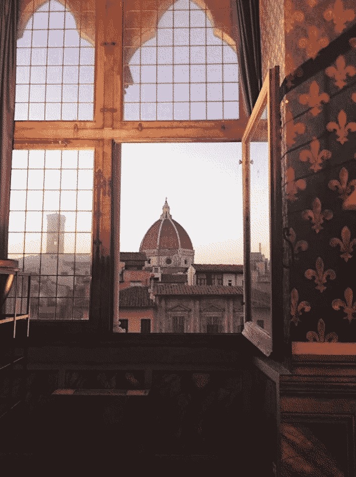 The view of the Florence Cathedral through a window.