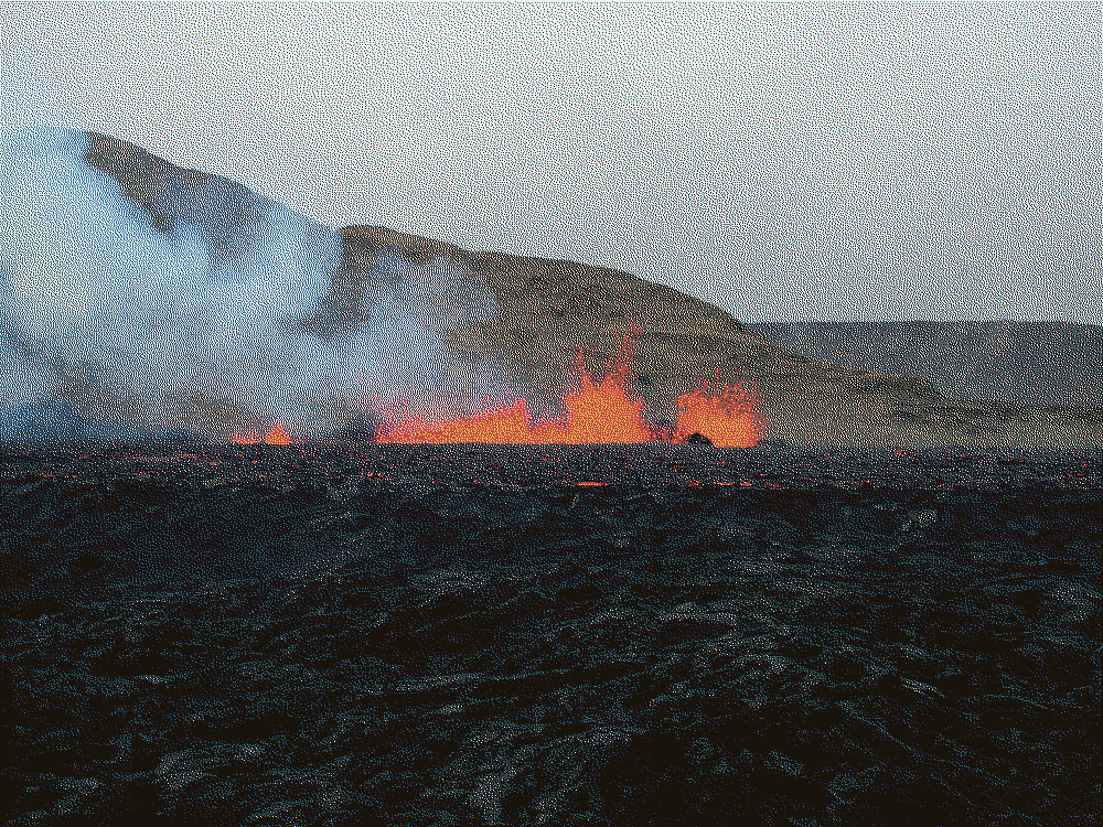 I was lucky to see a rare volcanic eruption when I was there. Lava shoots up from a barren lava field, about 100 meters away.