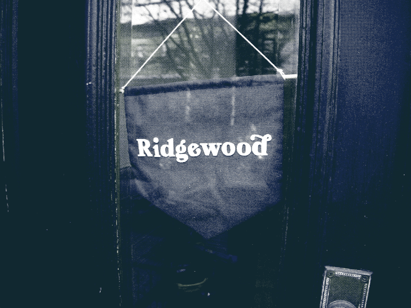 A nice sign on the inside of an apartment door window, reading Ridgewood.